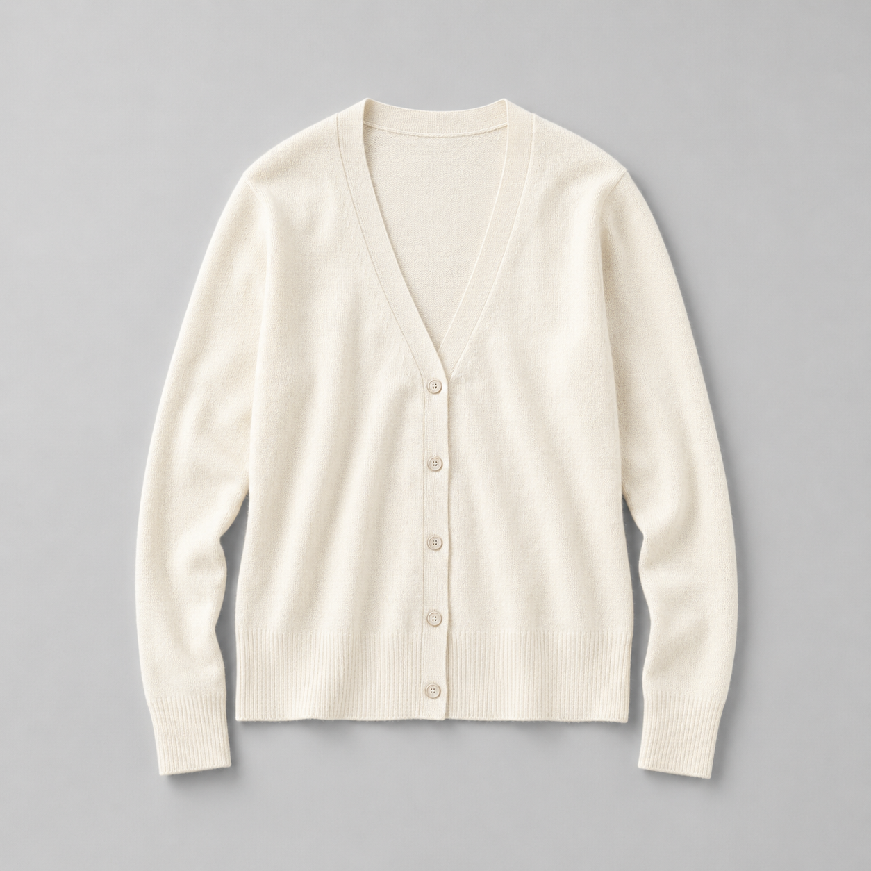 Cream cardigan flat lay